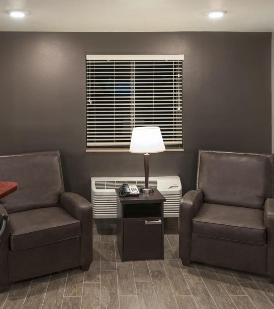 Unwind quietly with a lamp-lit lounge corner retreat.