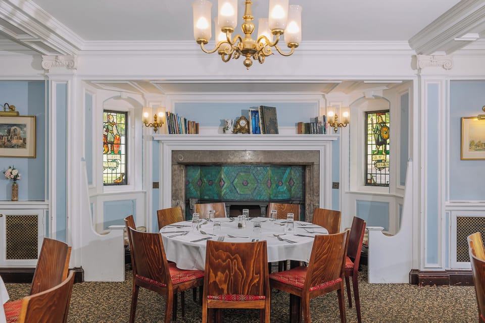 Savor intimate dining moments by the grand fireplace and stained glass.