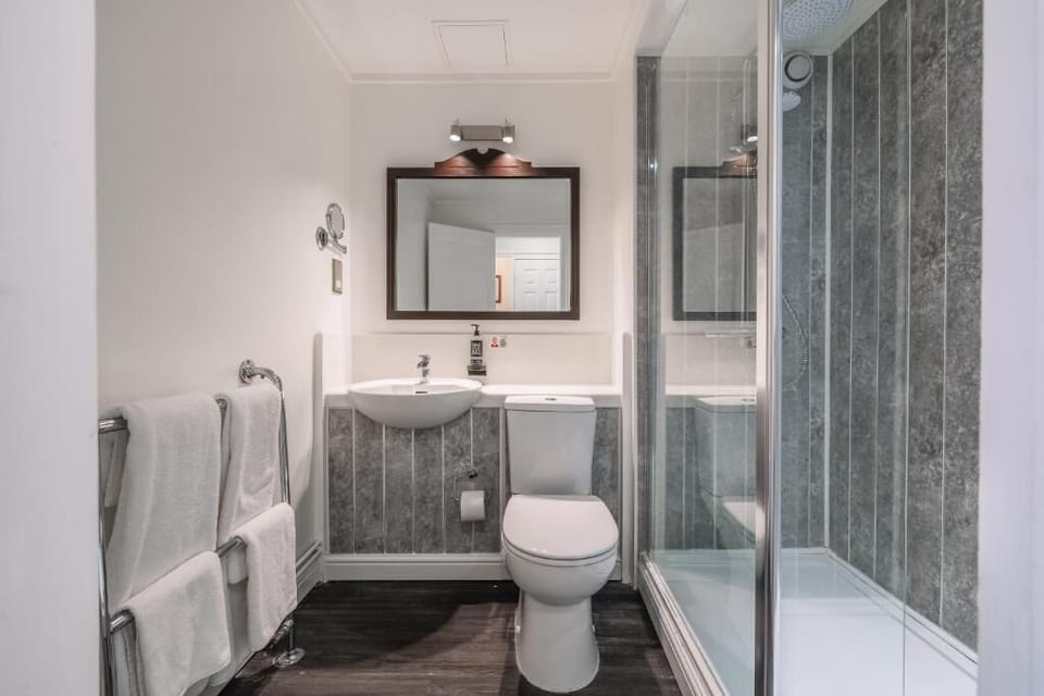Refresh in a spotless bathroom with a sleek glass shower.