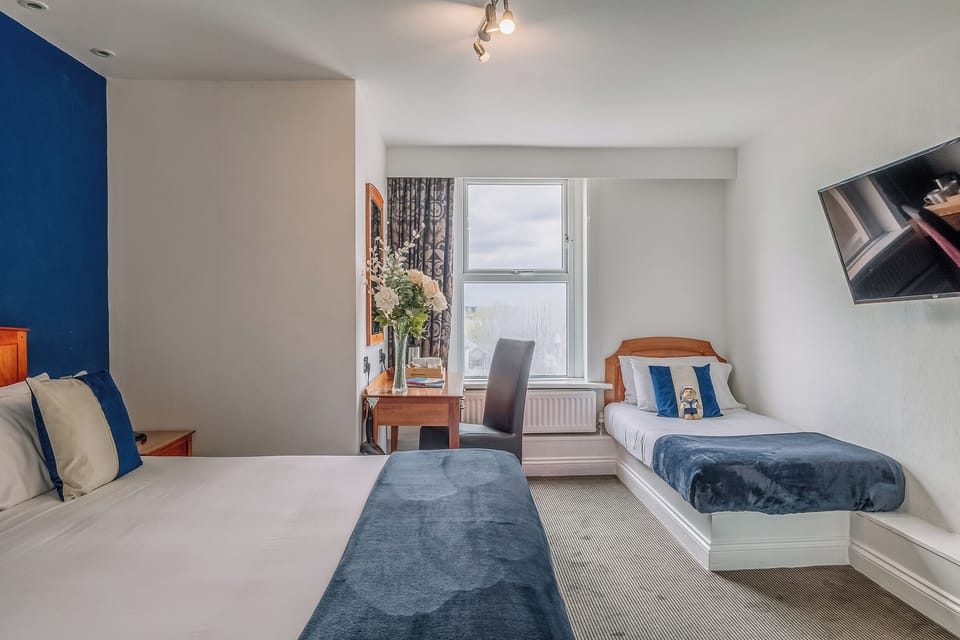 Recharge in warm, welcoming tones with comfortable beds for all.