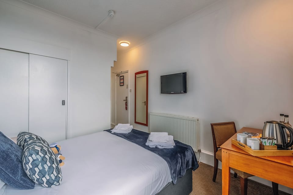 Settle in with crisp linens and convenient in-room refreshments.