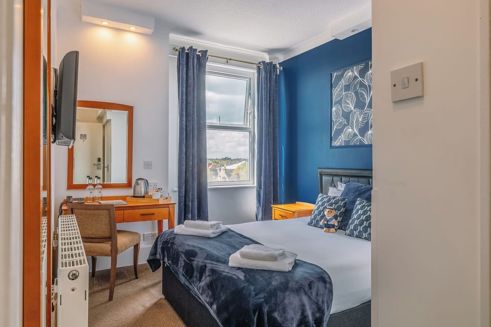 Wake up to daylight and a calm, stylish blue retreat.