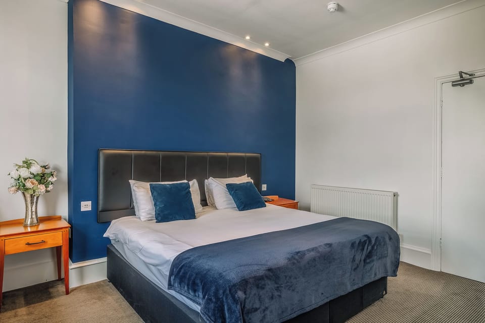 Spread out with a roomy layout, desk space, and skyline glimpse