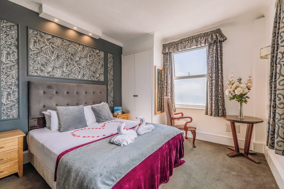 Sink into plush bedding and unwind in this romantic retreat.