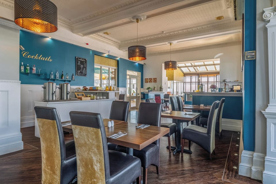Gather for breakfast or drinks in a lively, stylish room.