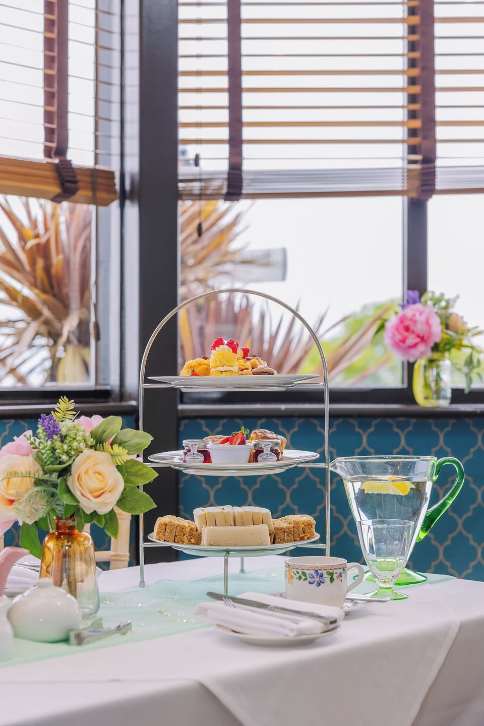 Indulge in delicate afternoon tea by the bright window.