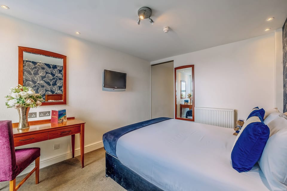 Settle in with a roomy desk and relaxing TV time.