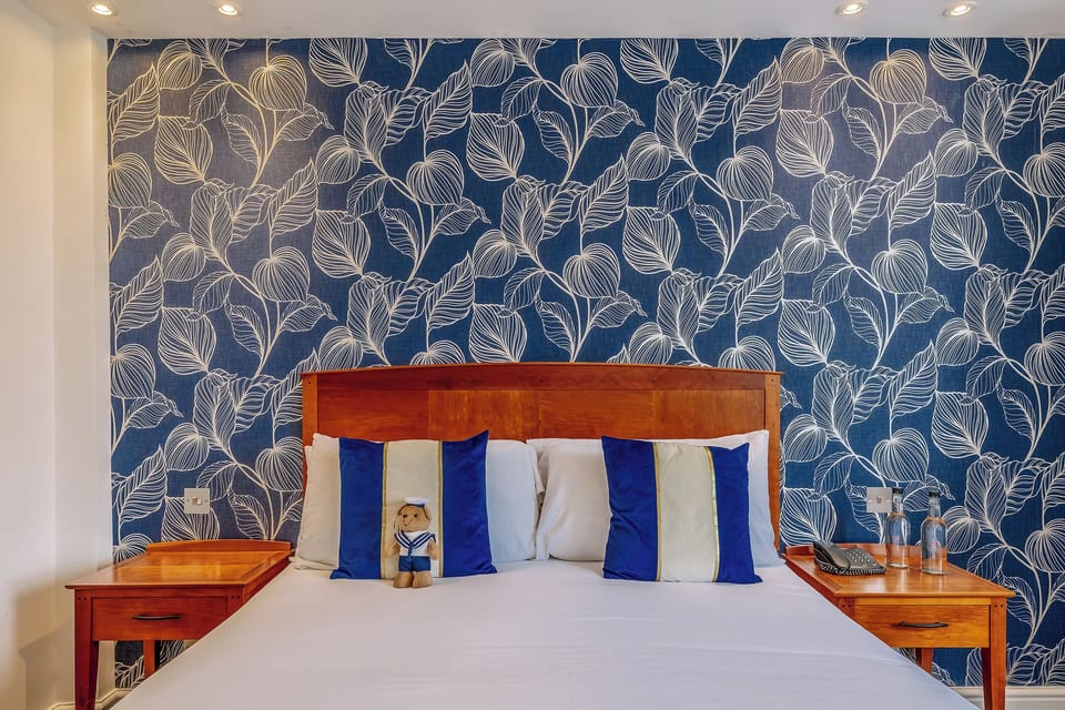 Drift off in a picture-perfect bed with crisp pillows.