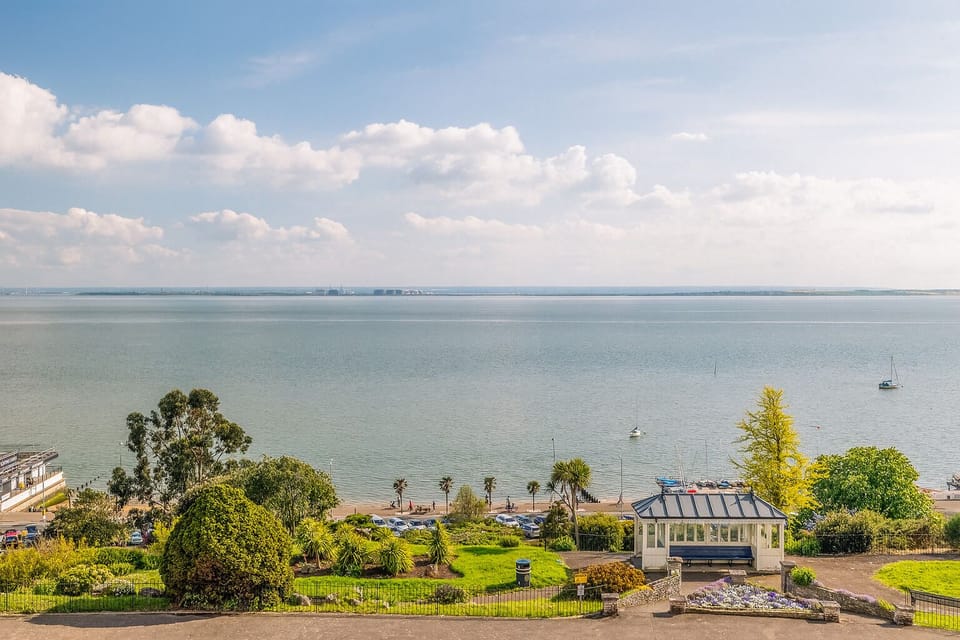 Soak in sweeping bay vistas above lush seaside gardens.