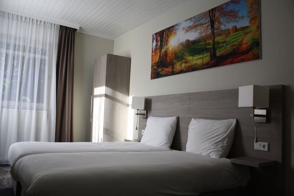 Unit with single beds. Exact unit will be assigned upon arrival. Views, colors, and decor may vary.
