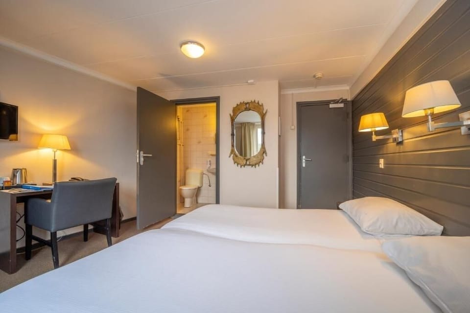 Unit with 2 Single Beds. Exact unit will be assigned upon arrival. Views, colors, and decor may vary.