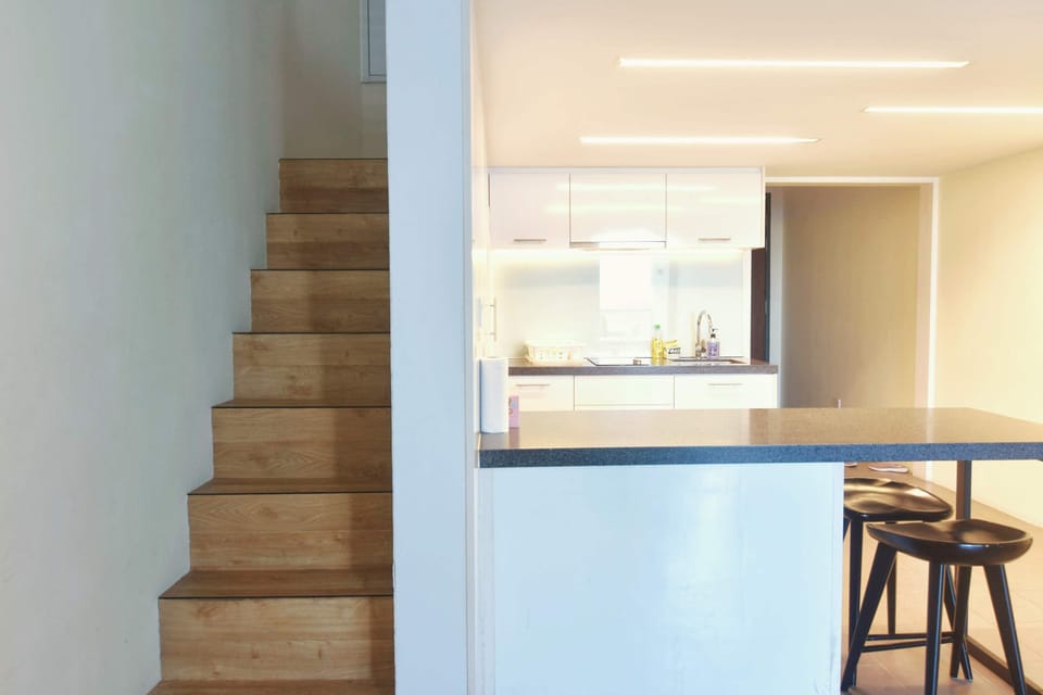 The stairs to the bedroom area.