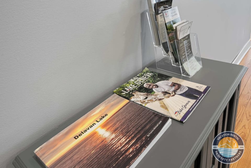 Entry table with welcome book and local guide.