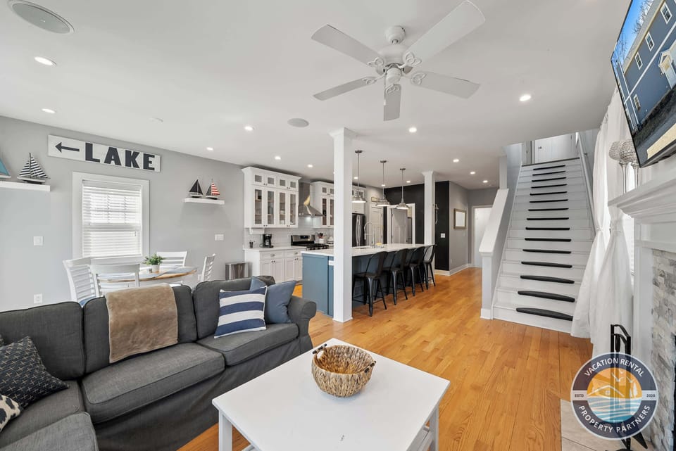 Bright and cozy living room with sectional and smart TV