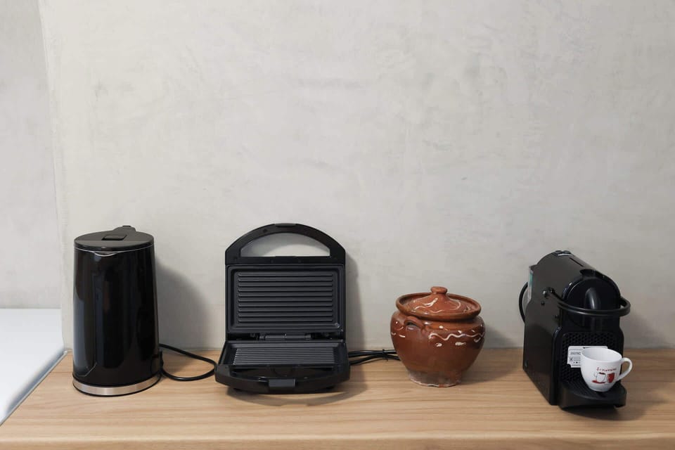 All the Essentials – A well-organized corner with modern appliances and utensils.