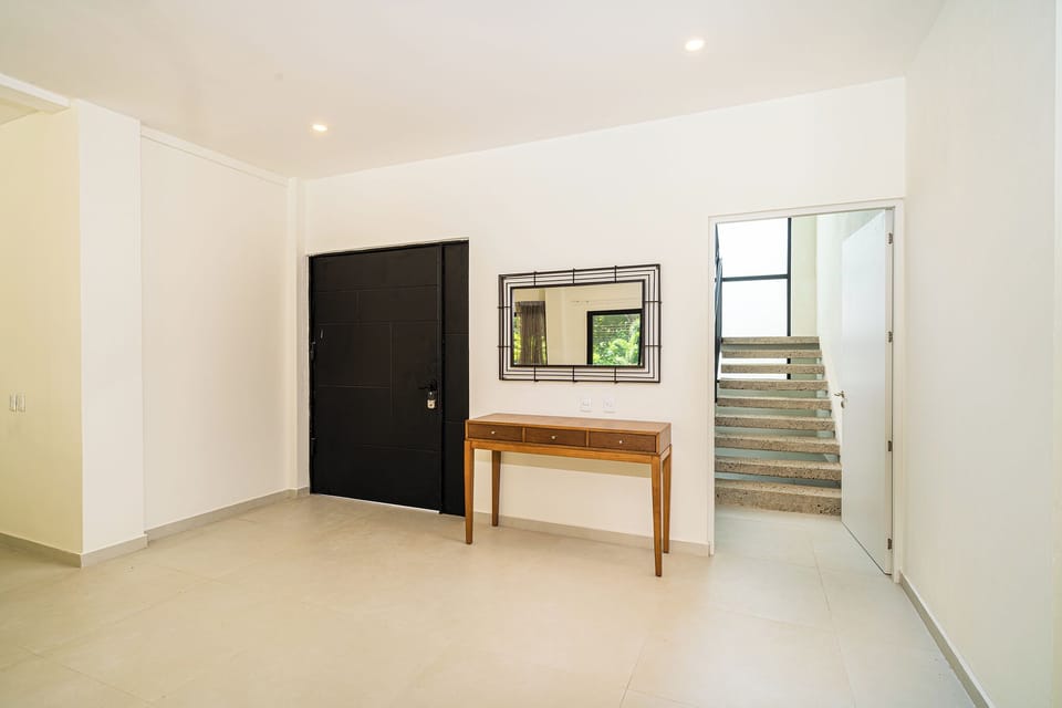 Entrance to the first floor and stairs to the second floor. 