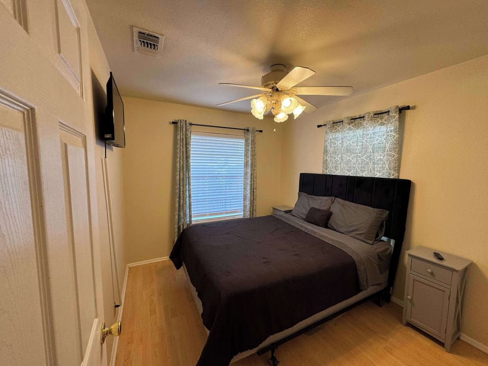 Recharge in the final bedroom, offering a queen bed & smart TV