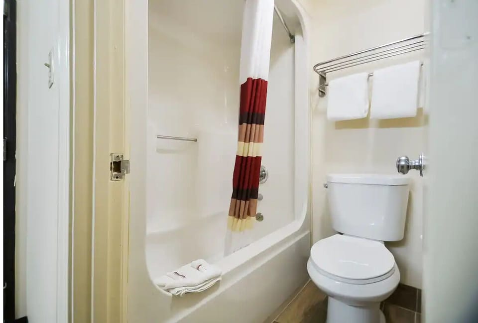 Refresh with a clean tub-shower combo and fluffy towels.