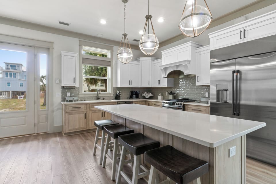 Your dream kitchen awaits with gleaming granite counters, premium appliances, and elegant pendant lighting perfect for creating memorable meals together.