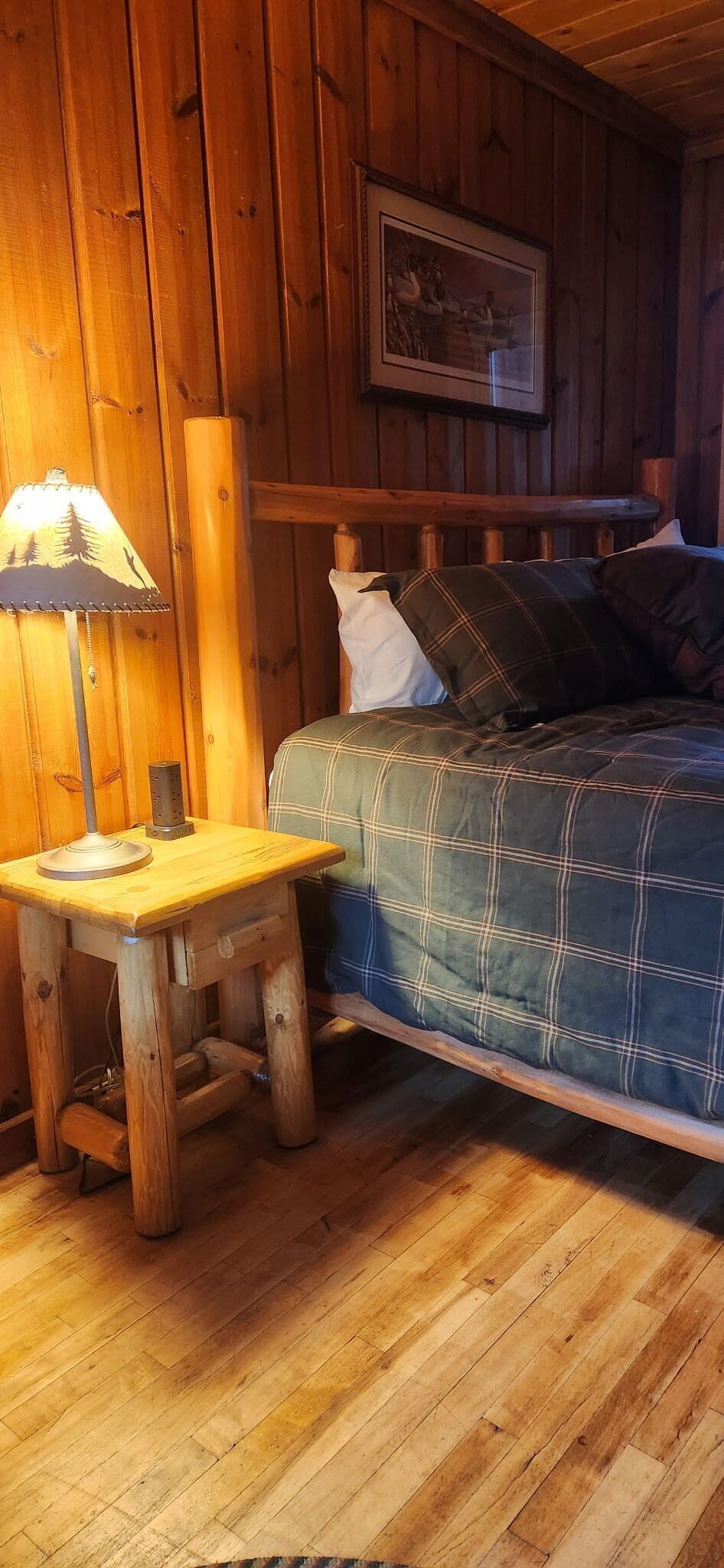 Sink into rustic charm with your cozy log bed and warm lamplight—perfect for unwinding after a day of adventures.