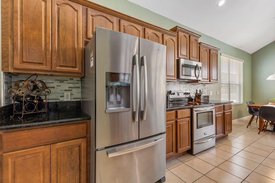 Stainless steel appliances in the large family kitchen. 
