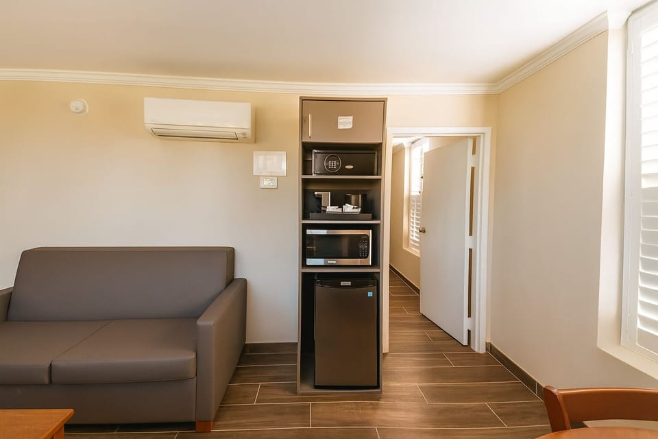 Grab snacks anytime with convenient microwave, fridge, and safe.