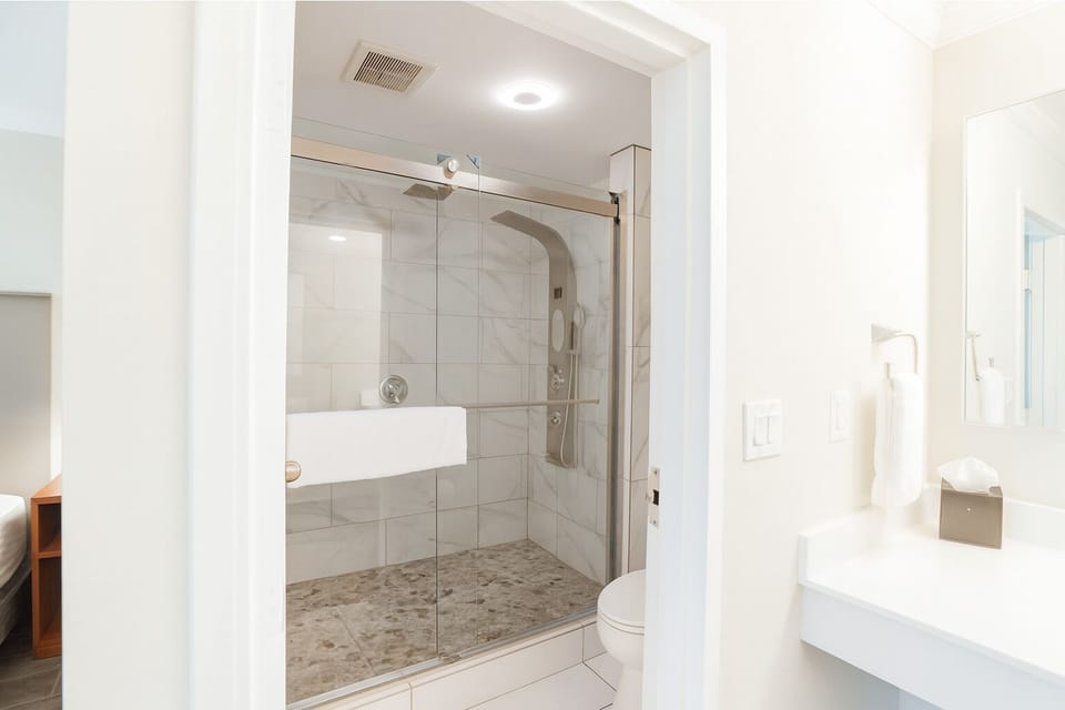 Refresh in a spotless bath with sleek glass shower.