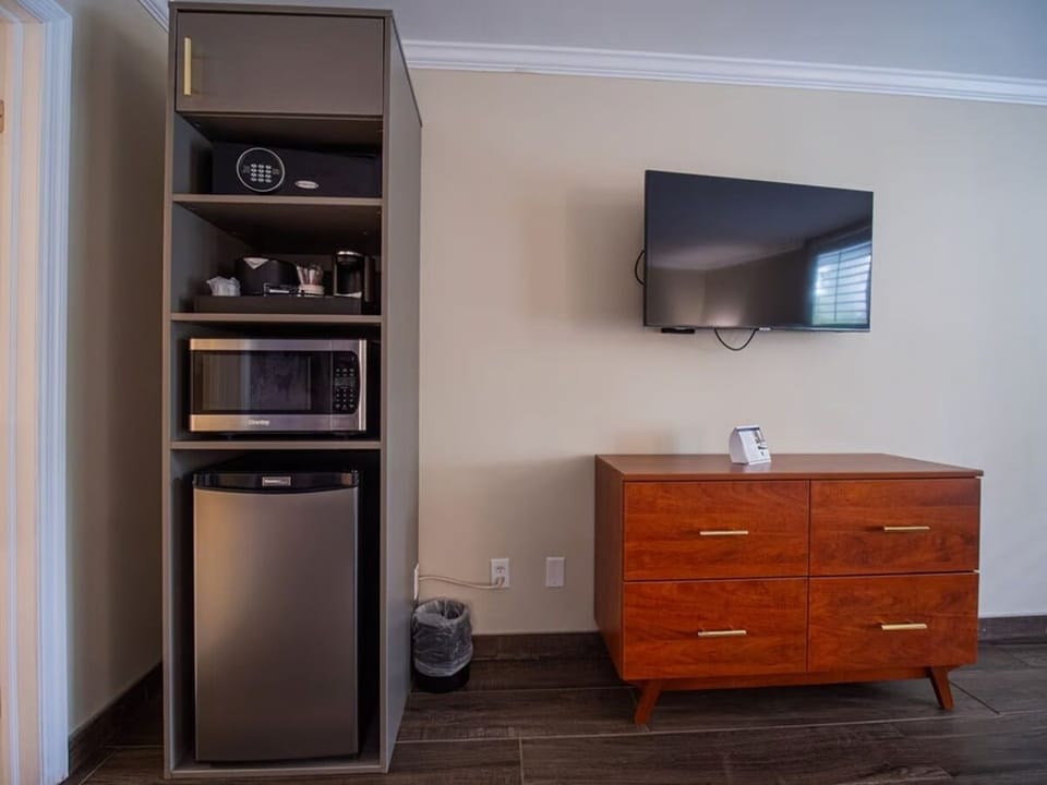 Enjoy easy snacks with mini-fridge, microwave, and secure safe.