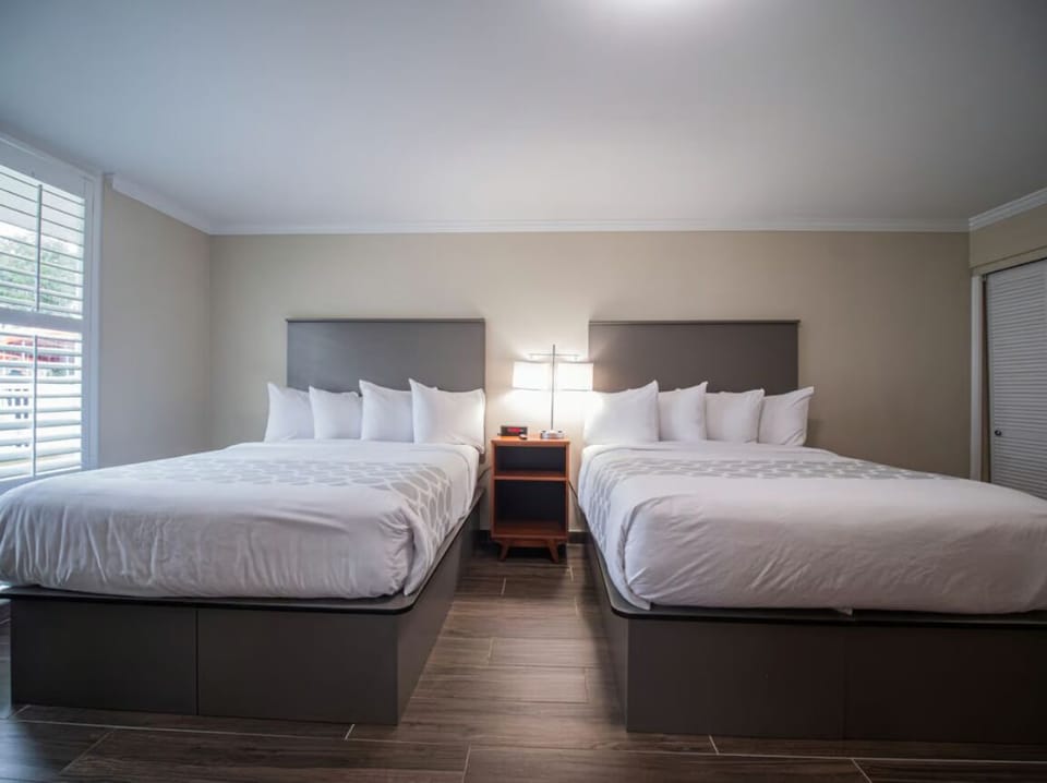 Unwind in crisp linens with spacious double-bed comfort.