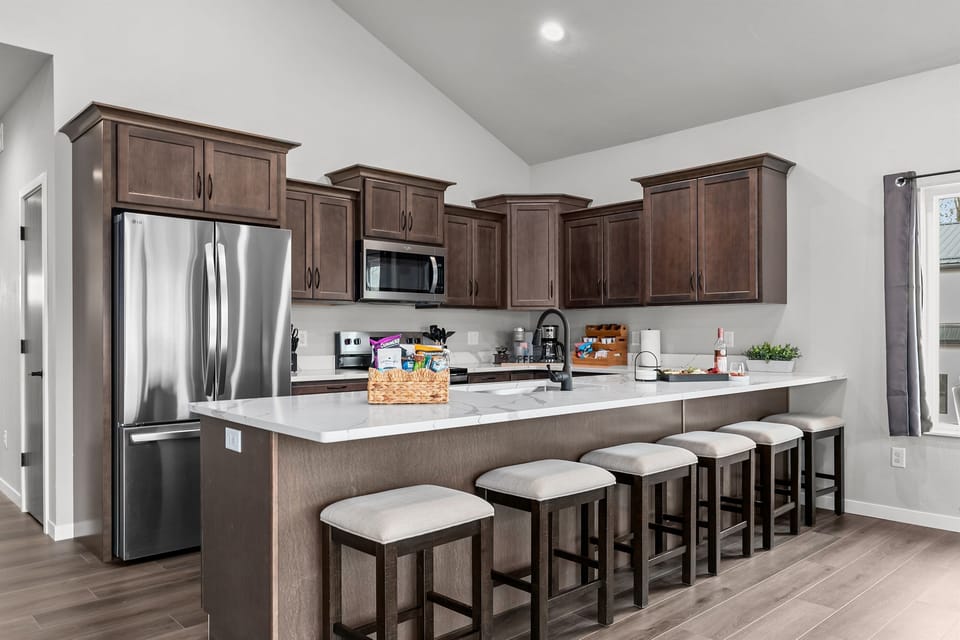 A fully stocked kitchen with stainless steel appliances—everything you need to whip up family favorites and gather around the table.
