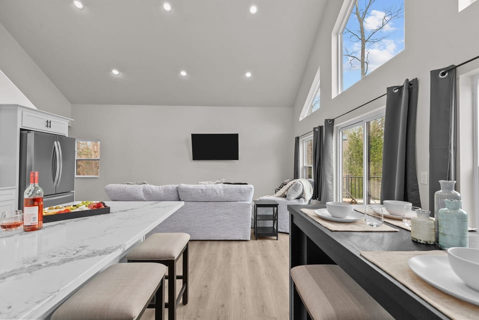 The dining area has room for everyone—gather around the high-top table or pull up a seat at the counter bar stools to chat, snack, or join in on the dinner prep. It’s all about togetherness, however you choose to enjoy it.