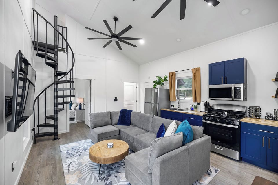 Living Area & spiral staircase leading to loft