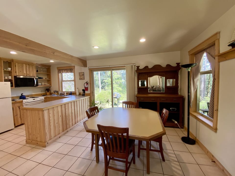 Gathering family is easy to do in this bright and open kitchen, dining and living room area.