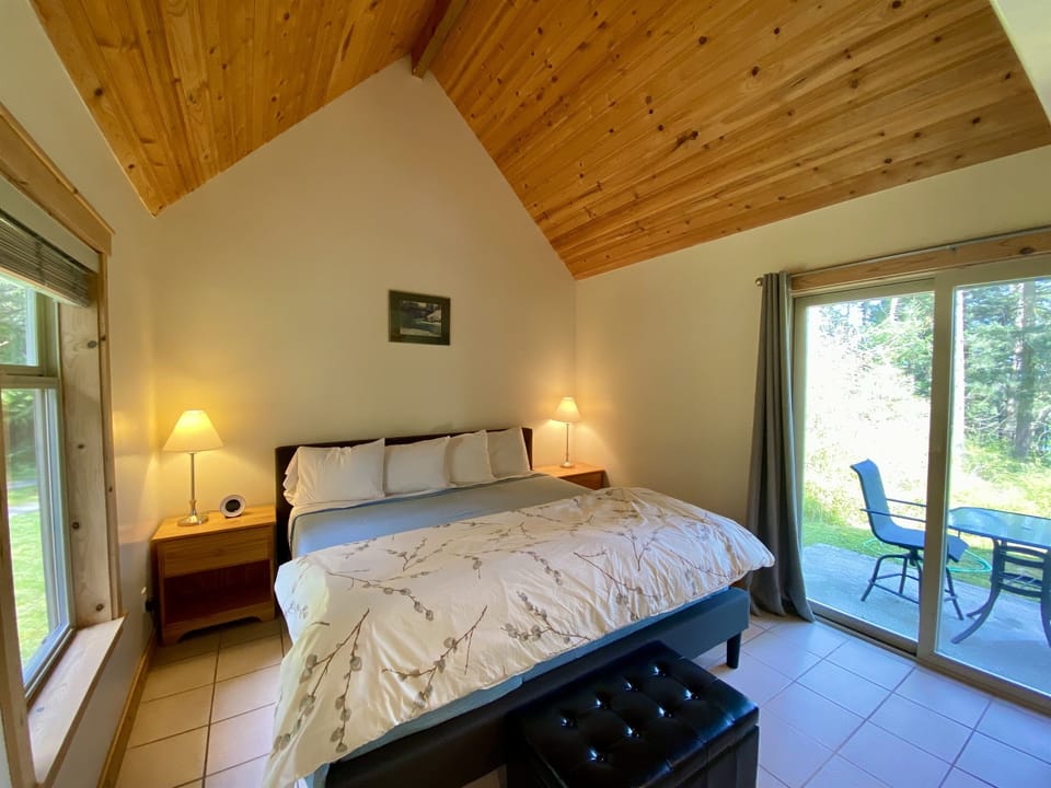 Wake up in this king-sized bed and step out onto your patio where you can enjoy coffee in the beautifully wooded backyard.