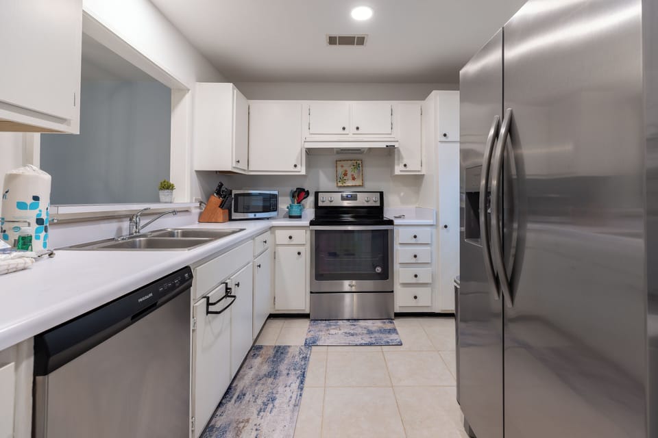 Open and modern kitchen with stainless steel appliances