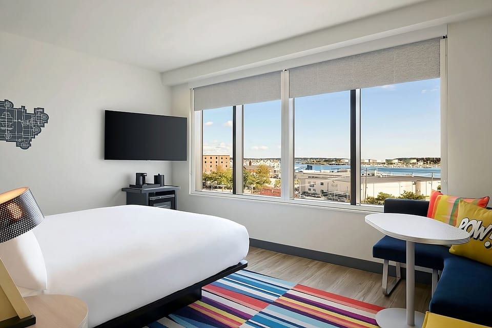 Wake up to sweeping waterfront views from your plush bed.