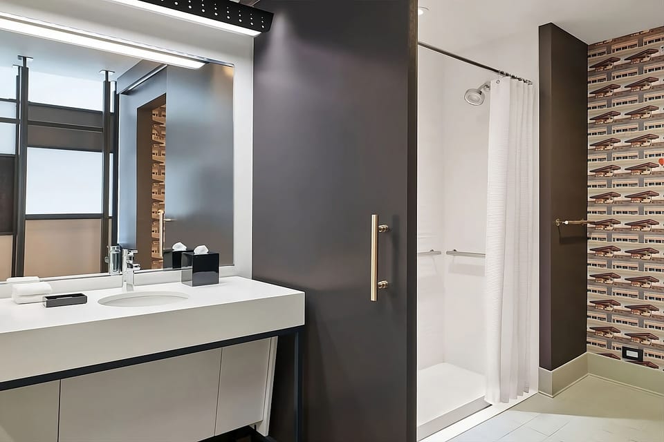 Rinse off in a bright shower with spa-simple comfort.