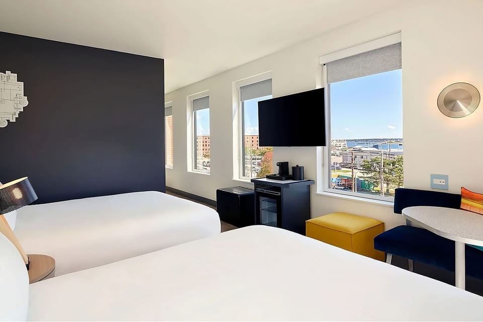 Unwind in bright twin beds with sweeping harbor views.
