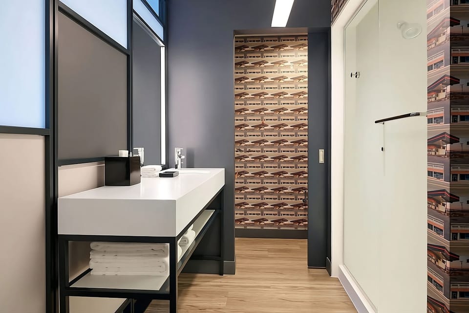 Reset your day in a sleek bath with fresh towels.