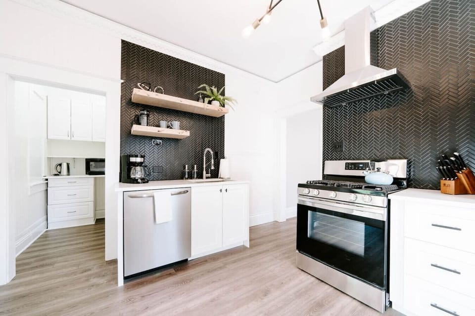 Fully remodeled kitchen with gas range and new appliances. Kitchen comes fully appointed with everything you need to cook a nice meal. There is also a French Press or drip coffee maker. A stove top kettle or electric kettle.