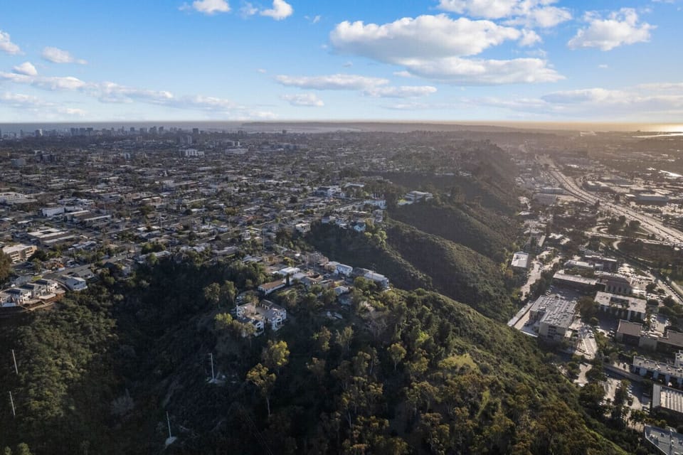 Enjoy panoramic views stretching from Mission Valley to the Pacific coastline from this elevated hillside escape.