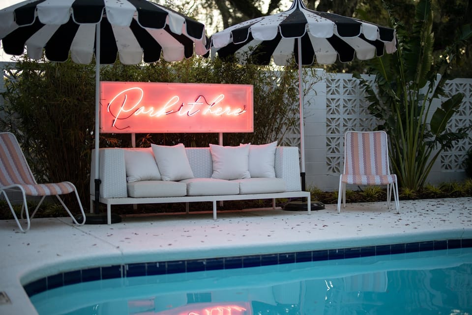 Common area seating around the fenced-in pool