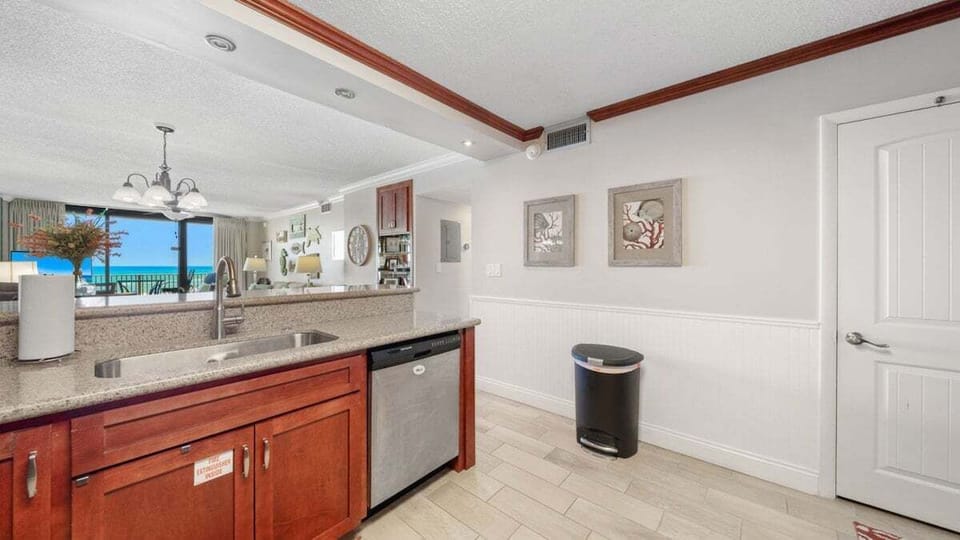 Open kitchen with Gulf views, clean design, and bright natural light for an inviting feel.