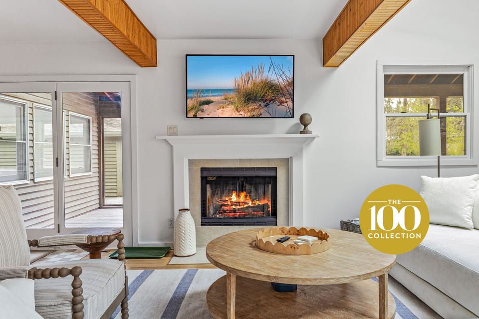 Welcome to Forest House —where rustic beams meet modern comfort. This living room glows with charm!