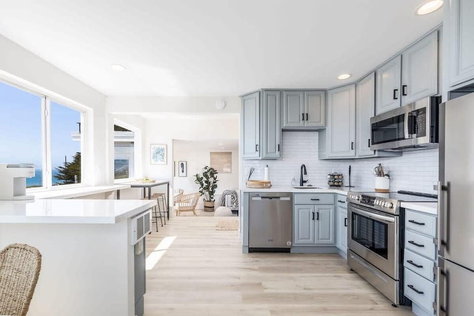 Open space with kitchen, living room and a fantastic view to the ocean
