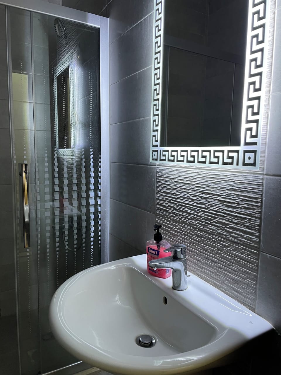 lighted mirrors in 2 bathrooms