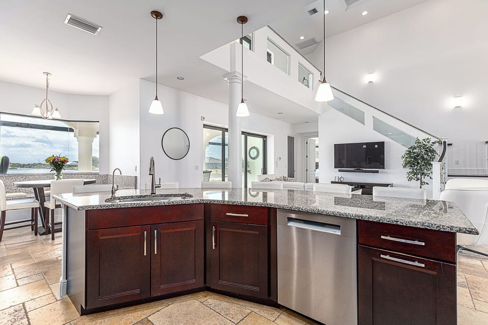 Dishwasher, large farmhouse sink and bar seating makes for a fun meal. 