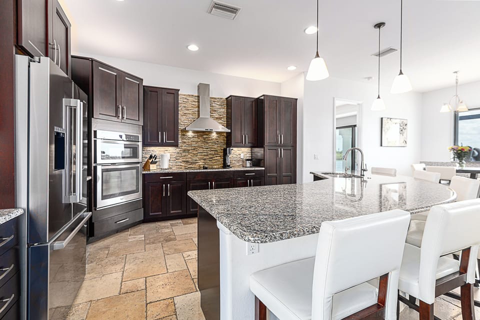 Stunning chef's style kitchen with lucky appliances and lots of seating. 