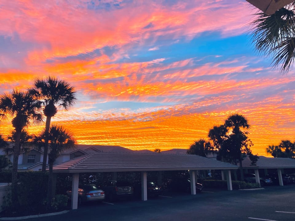 Spectacular sunrise over our carports and guest parking!