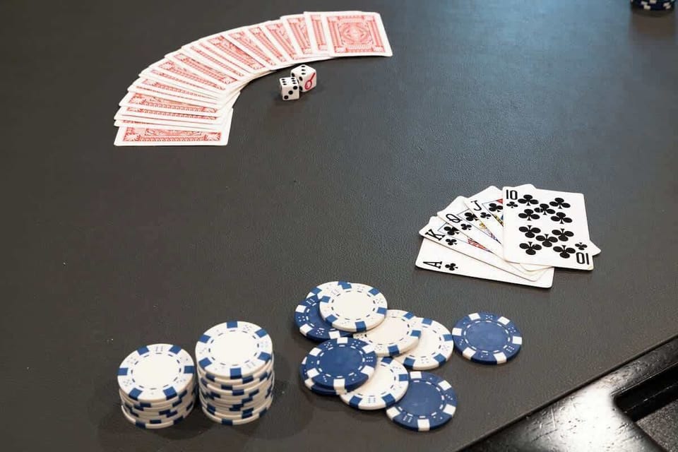 All in! Poker night is ready with cards, chips, and dice on a sleek table.